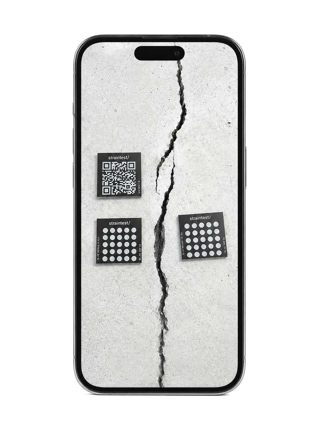 Phone showing straintest QR and dot tags installed on a cracked concrete wall